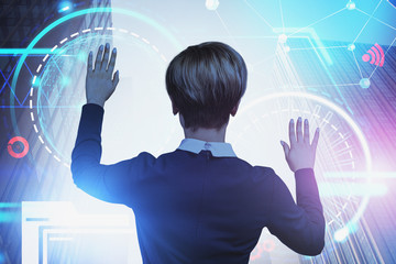 Businesswoman working with HUD interface in city