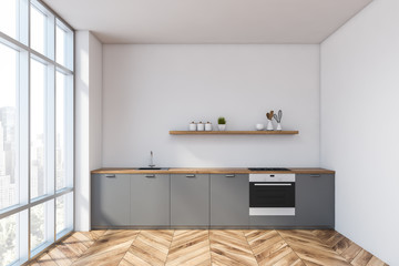 White kitchen interior with gray countertops
