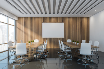 White and wooden meeting room interior with poster
