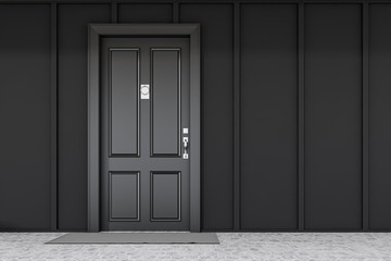 Black front door of black house with mat