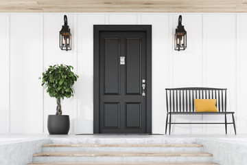 Black front door of white house, tree and bench - Powered by Adobe