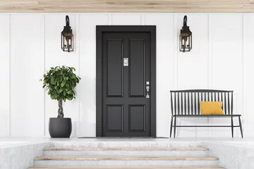 Fotobehang Black front door of white house, tree and bench © ImageFlow