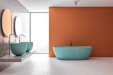 Naklejka na ściany i meble Orange and gray bathroom with blue tub