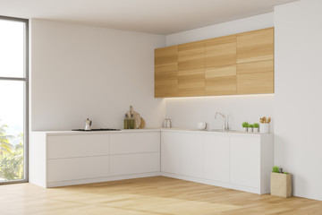 White kitchen corner with wooden cupboards