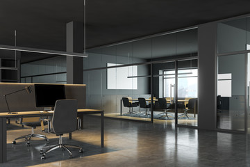 Dark gray office workplace with meeting room