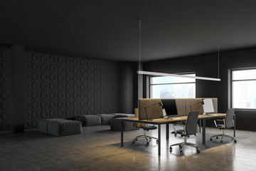 Dark gray open space office corner with lounge