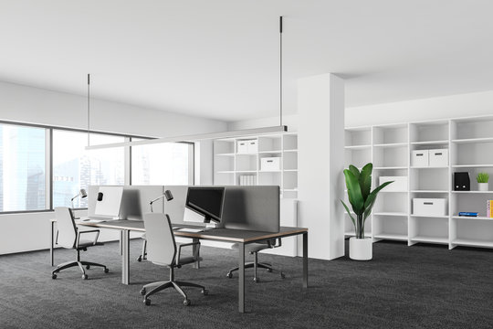 White modern office corner with bookcase