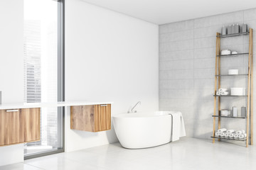 White bathroom corner with tub and shelves