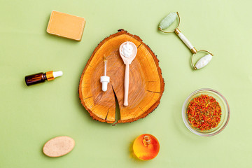 Organic ingredients for skin care on green background. Flat lay. Healthy lifestyle