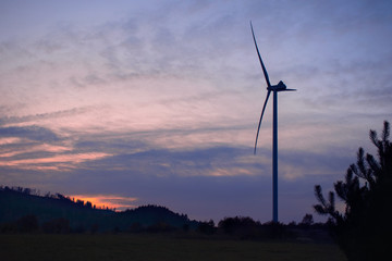 wind turbines at sunset