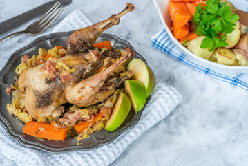 Pot-roast pheasant in cider with bacon and vegetables