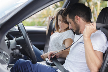 beautiful couple driving in a car