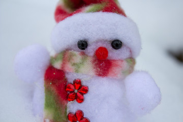 beautiful white snowman,white snowman toy with cotton wool in the snow
