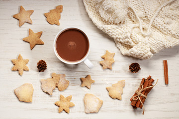 Hot chocolate in white cup with star shaped cookies