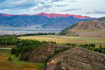 Mountain range lit by sunset light. Russia, mountain Altai, Ongudaysky district, Ursul river, Karakol and Kurota villages