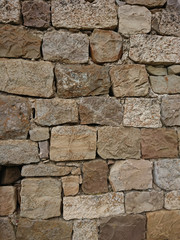 Wall with natural Sicilian stones, texture and background.