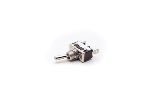 Automotive toggle switch on isolated white background. Automotive electric spare part.
