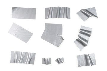 Silver scotch tape pieces isolated on white background.
