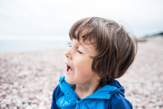 The Boy Is Sneezing.