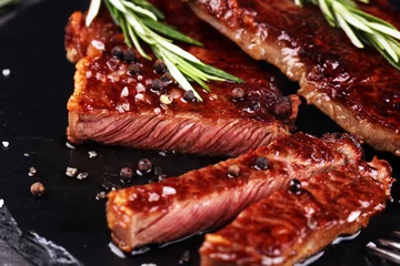 Tuinposter Barbecue Rib Eye Steak of rumpsteak - Dry Aged Wagyu Entrecote Steak op rustieke achtergrond © beats_