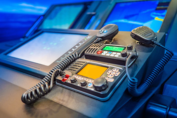 Work with a radio station. Providing communication. Radio station at the enterprise. Professional radio stations. The wireless station on the ship. Radiocommunication. © Grispb