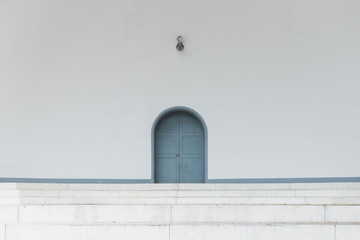 Old blue door in white background