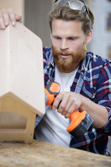 young man making home improvements