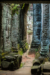 View inside the rubble-strewn ruins of Preah Khan Temple, Angkor, Cambodia., stone relief detail