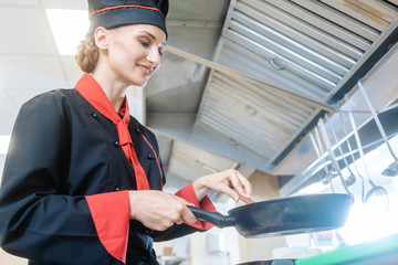 Chef stirring a meal