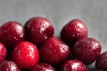 Red cherries in water drops close-up. Cherry berry background. Berry pattern and texture. Food background. Fresh ripe berries.