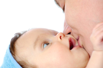 Close-up a caring young mother wipes girl