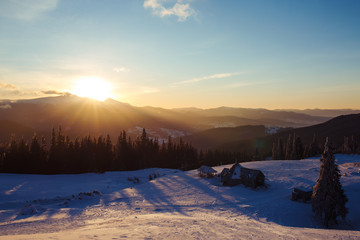Sunrise in the mountains. Beautiful view of the mountains from a high point. Dawn in mountain...