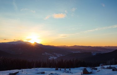 Sunrise in the mountains. Beautiful view of the mountains from a high point. Dawn in mountain...