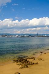 Sea view with transparent water in kanawajima, Hiroshima city in the background, Japan
