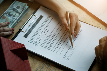 estate agent with customer after contract signature of buying house, Sign contract for more money,...
