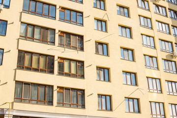 Obraz premium living building ordinary architecture exterior facade wall and windows background 