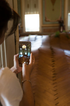 the woman take photo with smart phone in historical pavilion