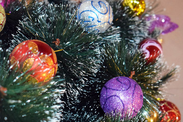 Obraz na płótnie Canvas Christmas tree decorated with glass balls. Festive background for greeting cards.