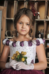 Vintage portrait of little girl in purple dress