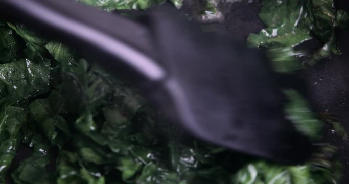 Сooking spinach in frying pan
