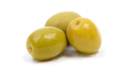 wet green olives in brine drops isolated
