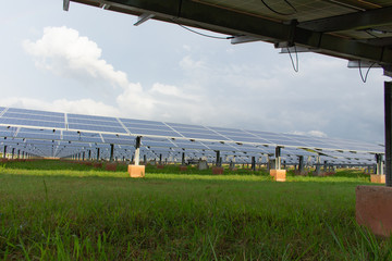 Large number of solar cell panels on white clouds background,