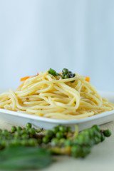 Spaghetti lines in white dish on the table,