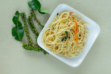 Spaghetti lines in white dish on the table,