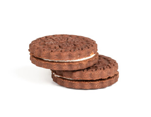 brown chocolate round cookies in a stack isolated on white background