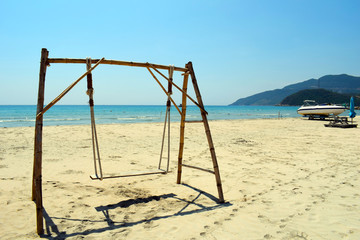 Swing on the beach. Sea view. Tropical island.