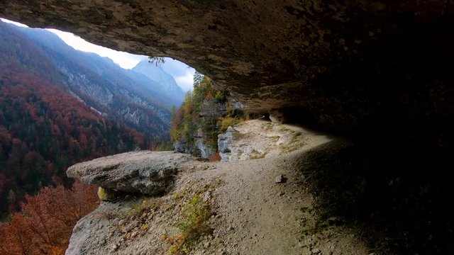 4k Forward moving walking on lone cliff trail path with hills and  forest valley incredible view