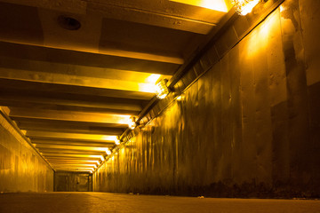 Empty underground passage with glowing lights