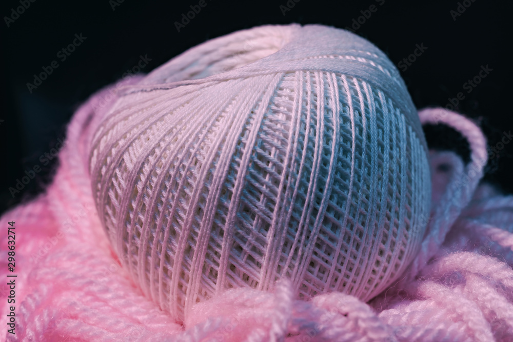 Poster close up beautiful tangle of thread in red and blue light on a dark background. macro photography vi