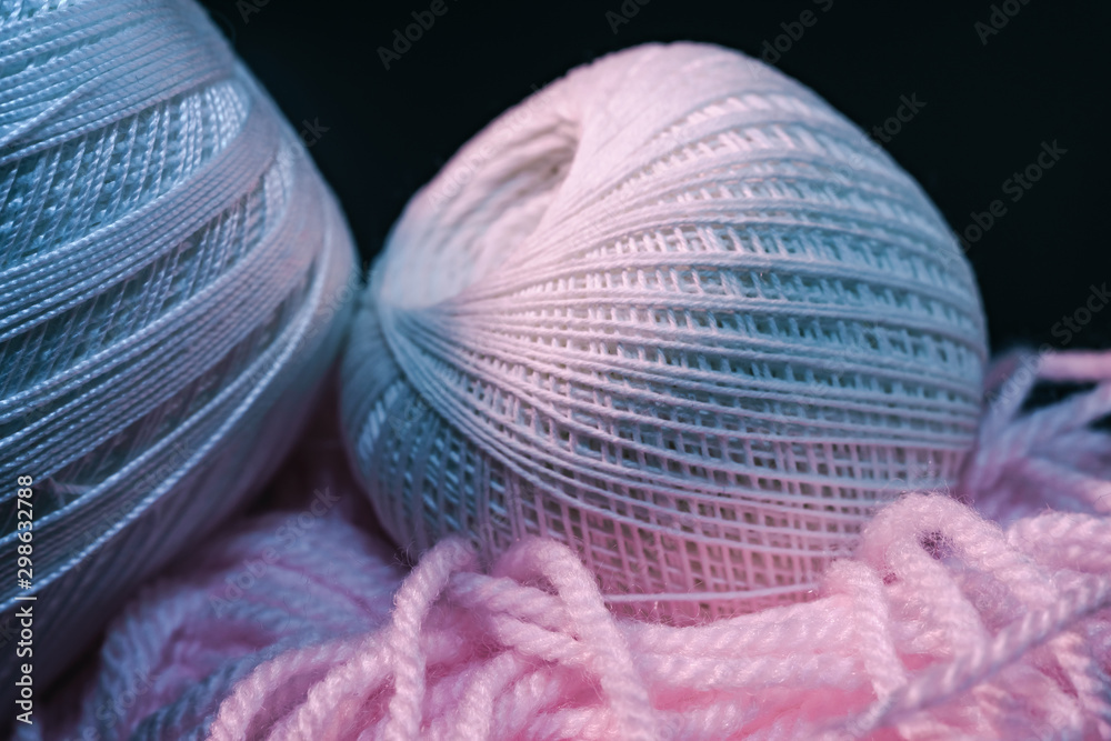 Poster close up beautiful tangle of thread in red and blue light on a dark background. macro photography vi